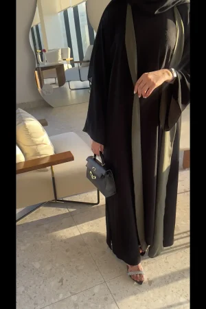 Versatile reversible abaya with black and olive hues, perfect for transitioning between looks.