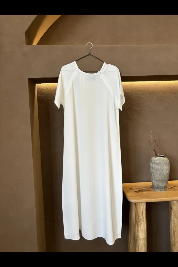 Comfortable off-white breastfeeding inner dress designed to provide easy access and stylish coverage.