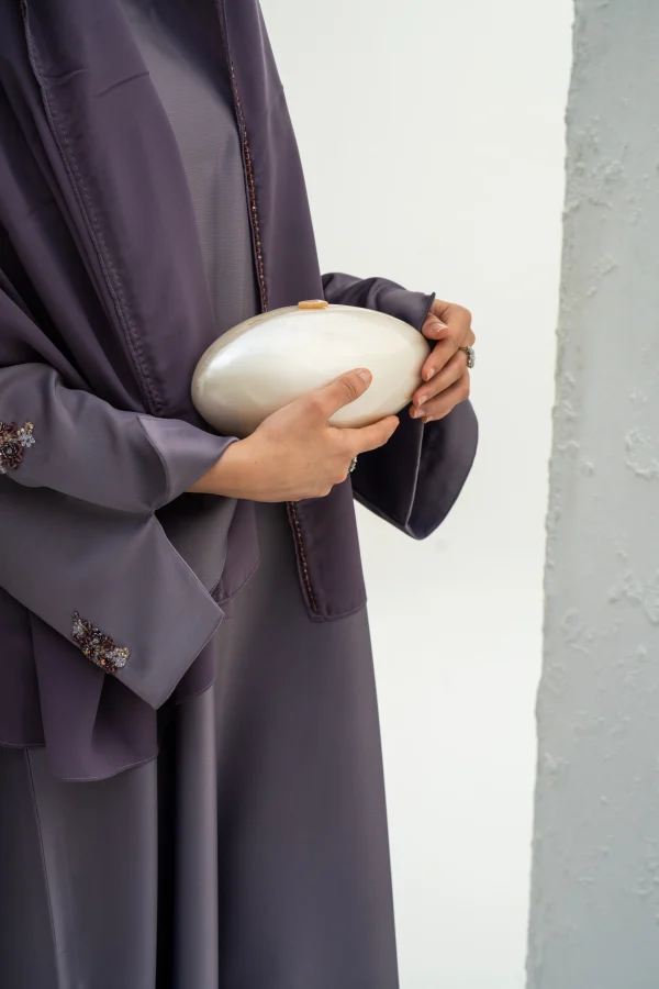 A model wearing Arwa abaya lavender frost