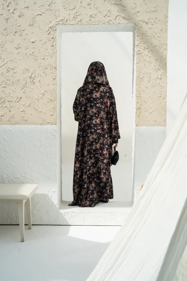 A floral print dark abaya with matching hijab