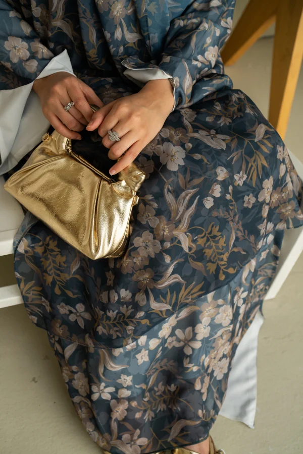 A model wearing mahra abaya in a slitted sleeve