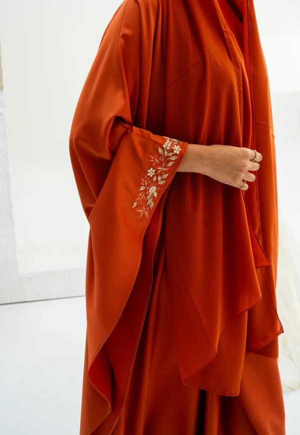 A model showing her embroidered kaftan dress sleeve
