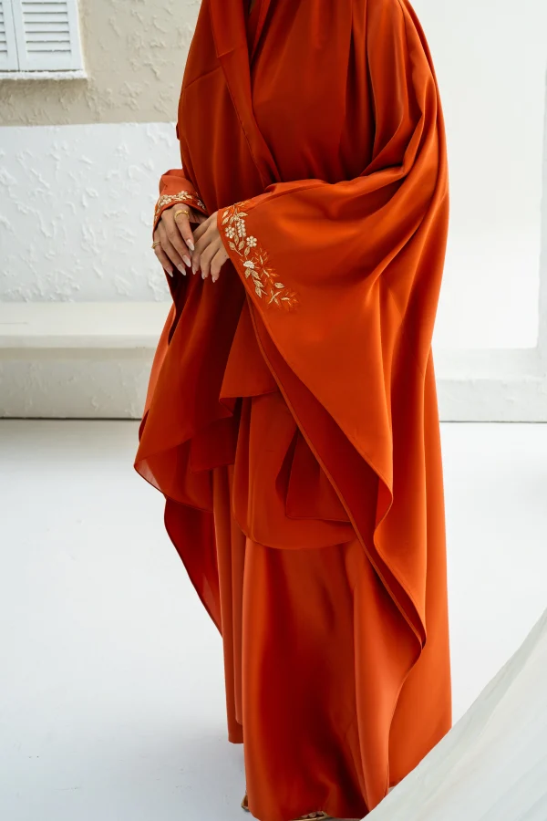 A model in a free kaftan dress