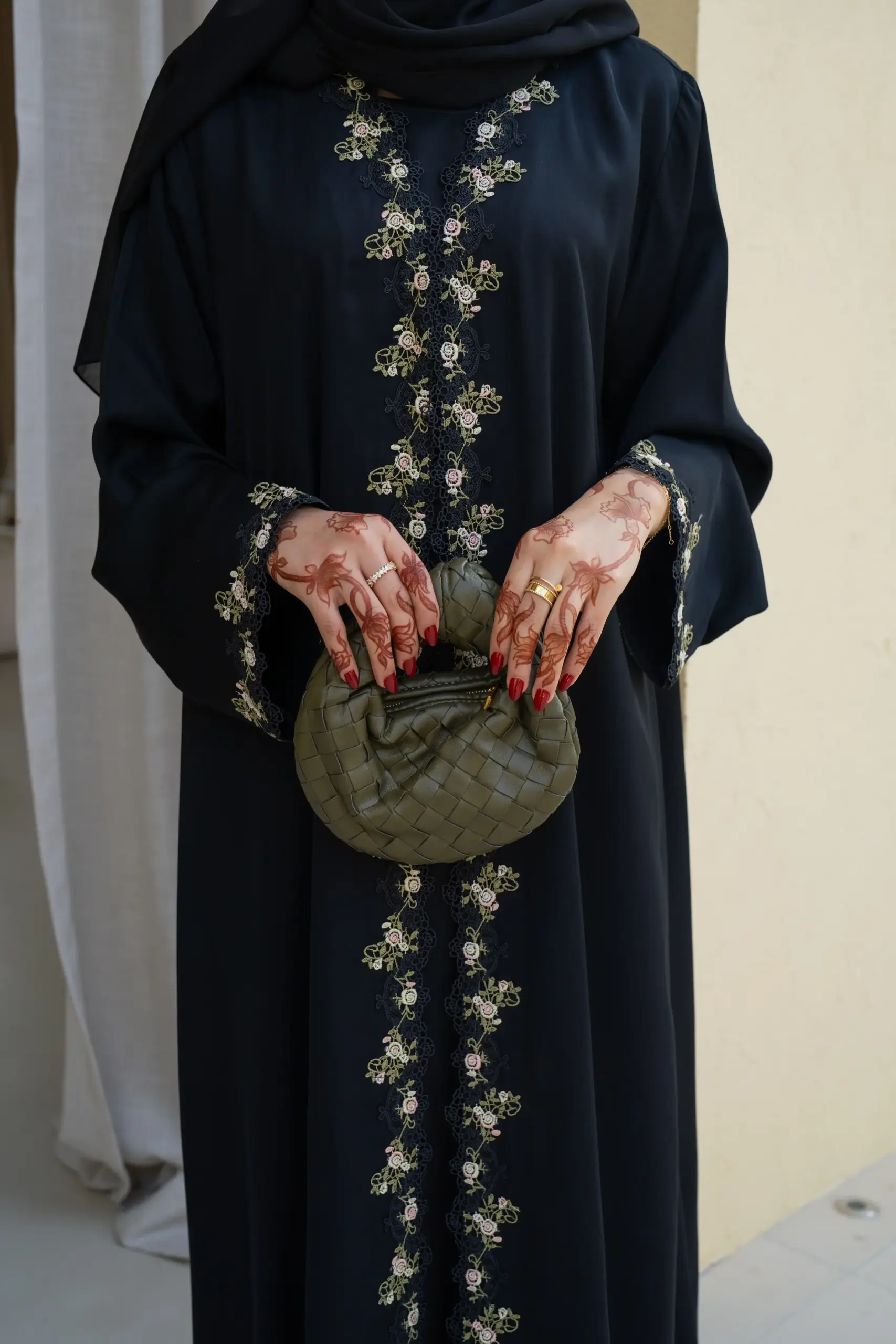 Full length flowing outer layer with delicate floral lace trim on the front sides and cuffs, paired with a coordinating hijab